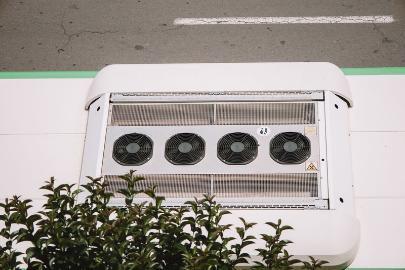 Air conditioning unit serviced by technician